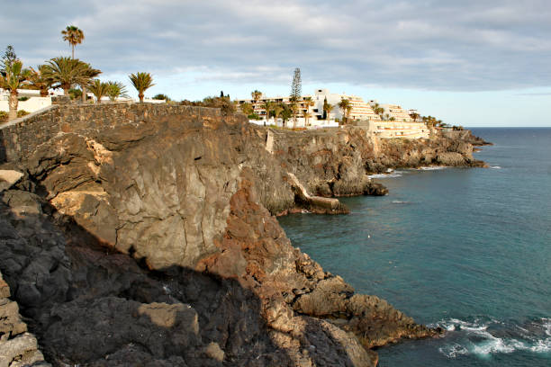 istock Costa del Silencio - high volcanic coast with rock formation 1015022890