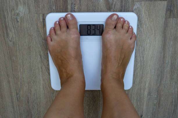 istock A man stands on the scales 1015029970