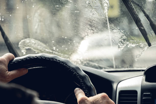 istock Driving the car. Glass Washer 1015030324