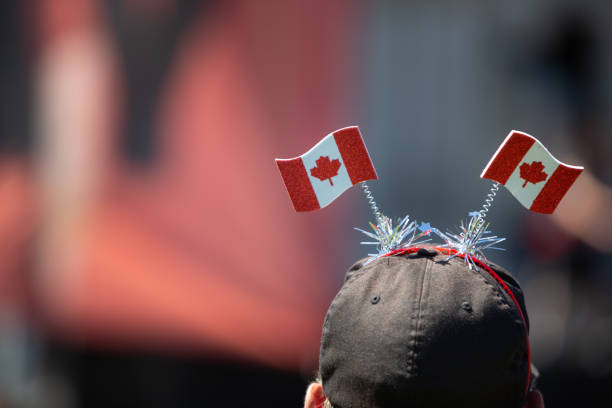 istock Celebrating Canada Day with a headdress made of Canada flags. 1015042162
