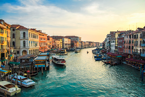 Buildings, boats  and Gondolas in Venice, Grand Canal. View from Rialto Bridge. Colorful venetian cityscape