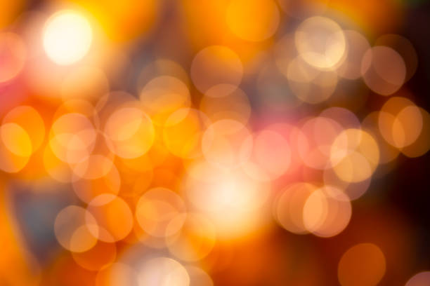 istock Bright round bokeh on orange background 1015042878