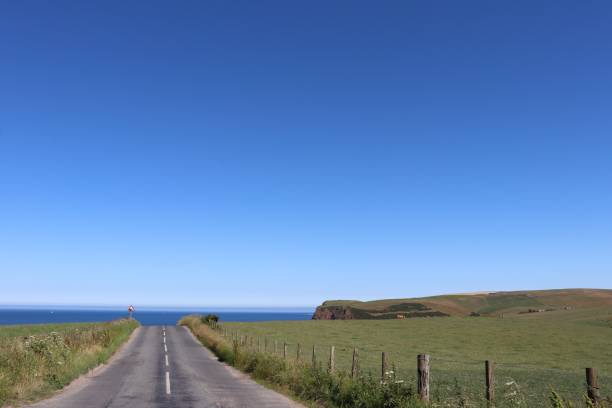 istock Road at top of hill 1015045388