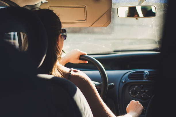 istock Girl driving car 1015067376