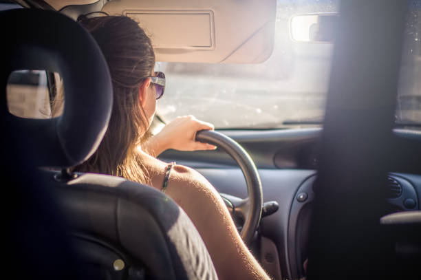 istock Girl driving car 1015067404