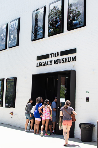 Montgomery, Alabama/USA-August 6, 2018: People entering The Legacy Museum in downtown Montgomery. The museum is on the site of warehouses where slaves where held and a few blocks from one of the biggest slave auctions in the country.