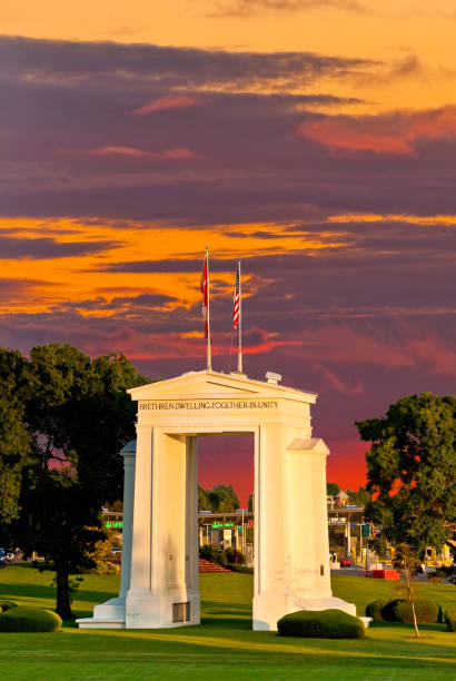Peace Arch at Sunset The Peace Arch on the USA/Canada Border was built to dedicate 100 years of peace between the United States and Canada. The project was commissioned in the early 20th century by the wealthy railroad executive and entrepreneur Sam Hill who was also a Quaker pacifist. The Peace Arch, built in 1921, is located between Douglas, British Columbia, Canada and Blaine, Washington State, USA. blaine washington stock pictures, royalty-free photos & images