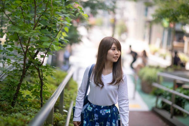istock Young woman walking on street 1015106976