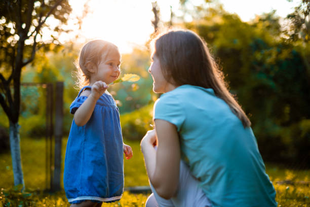 istock Mother and Daughter playing outdoors 1015116920