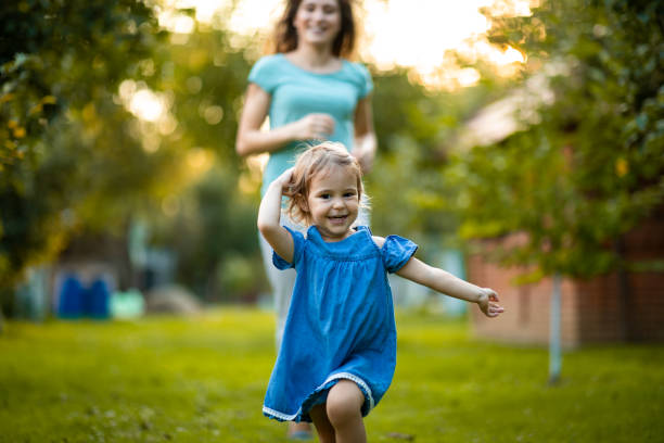 istock Mother and daughter running 1015116980