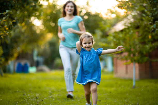 istock Mother and daughter running 1015116996