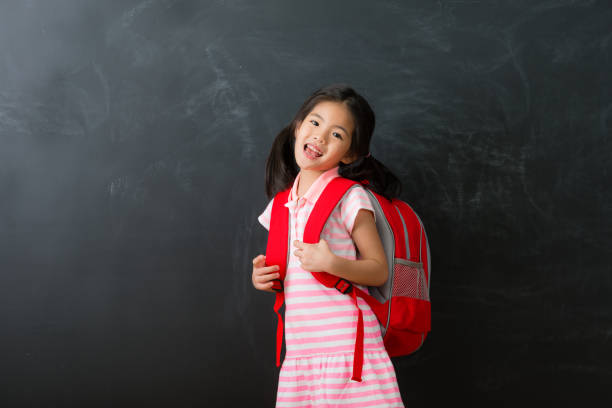 istock girl student carrying bag prepared back to school 1015117496