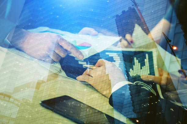 istock business brainstorm meeting conference table with people consulting with graph chart analysis paper  business success ideas concept 1015122546