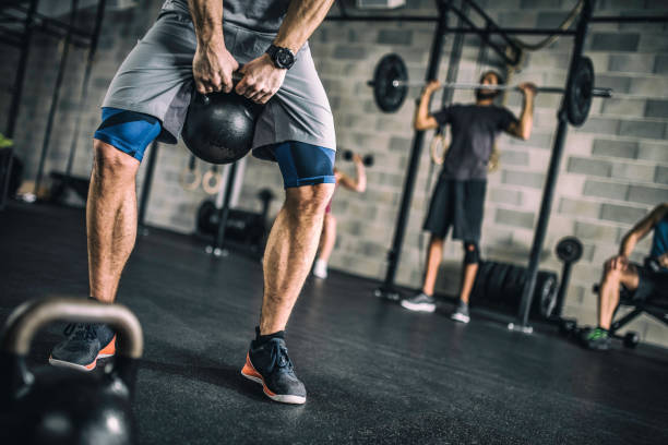 istock People exercising with weights in the gym 1015125658
