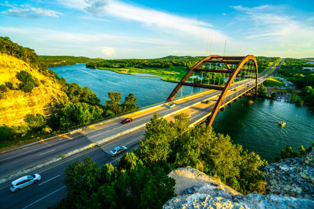 suspension bridge transportation crossing the colorado river in austin , texas - old town imagens e fotografias de stock