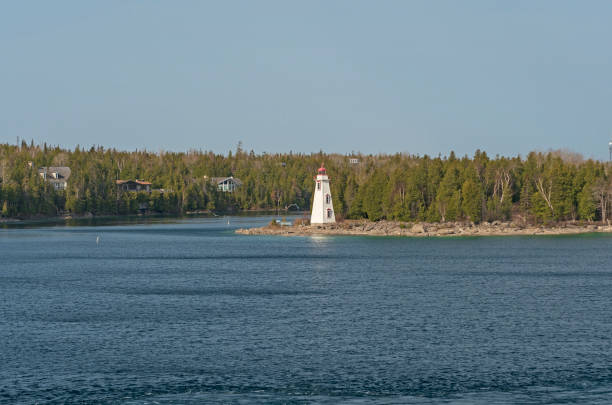 istock Harbor lighthouse on an Early Spring Day 1015157684