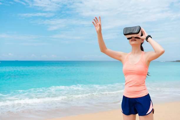 istock smiling beauty girl jogger wearing VR technology 1015160134
