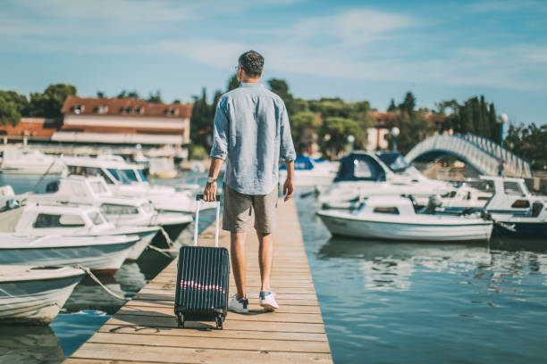 istock Tourist walking on pier 1015162556