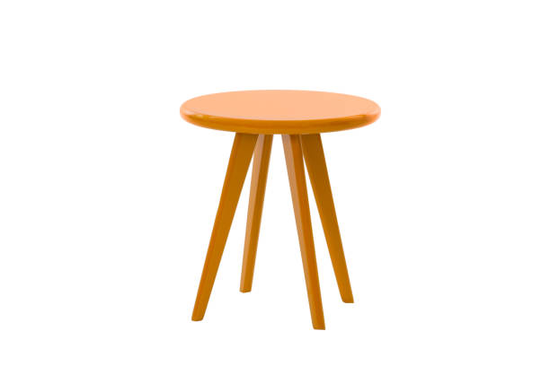 istock Orange round table with legs on a white background 1015162900