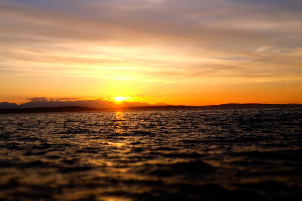 istock fiery orange sunset at the puget sound 1015168892