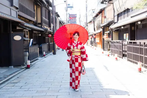 portrait of attractive asian woman wearing red kimono
