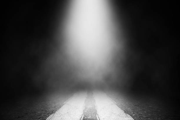 istock White smoke spotlight on floor road background. 1015169520