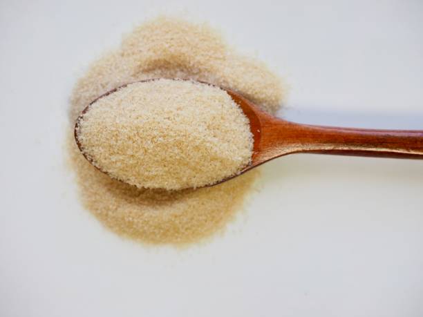 istock Brown powdered sugar in a spoon 1015172698
