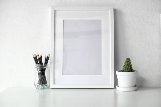 istock Mockup poster on white desk. 1015180326