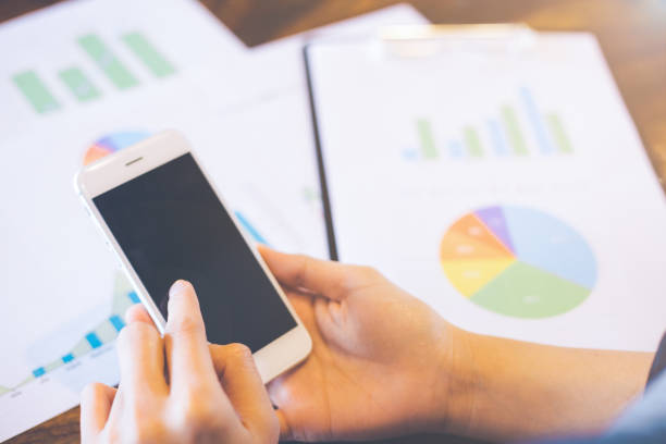 istock Business work with mobile phones on statistics and business graphs. 1015188896