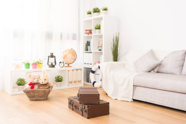 photo of kid playroom with toy and vintage suitcase. travel concept.