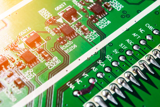 istock Macro shot of a Circuitboard with resistors microchips and electronic components. Computer hardware technology. Integrated communication processor. Information engineering. Semiconductor. PCB. Closeup 1015198060
