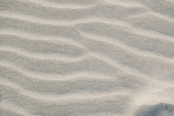 Close up of white sand on the beach with arid texture