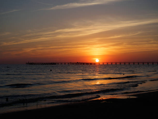 istock Sunset over the sea pier 1015207098