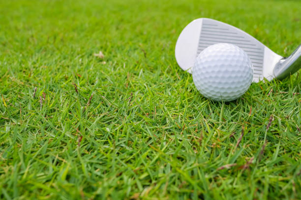istock Golf Course where the turf is beautiful and Golf Ball on fairway. Golf course with a rich green turf beautiful scenery. 1015211960