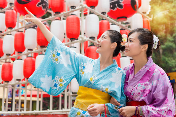 travelers standing in front of celebration lantern