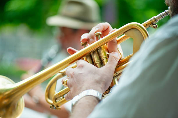 istock Trumpet player performs street performances with his group 1015218054