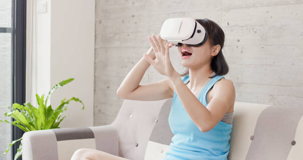 istock woman wear vr watch game 1015243774