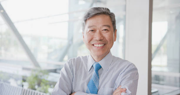 istock old businessman smile happily 1015246914