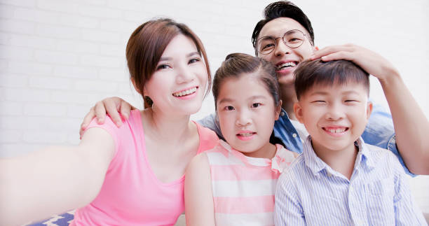istock family selfie happily 1015249566