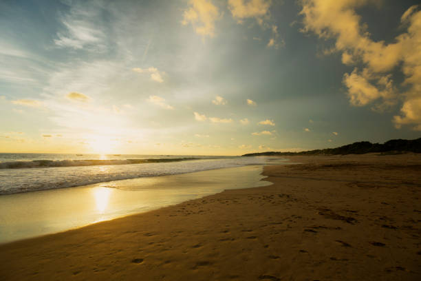 Beautiful Pangumbahan beach scenery at dawn time in Ujung Genteng, Sukabumi, West Java, Indonesia.