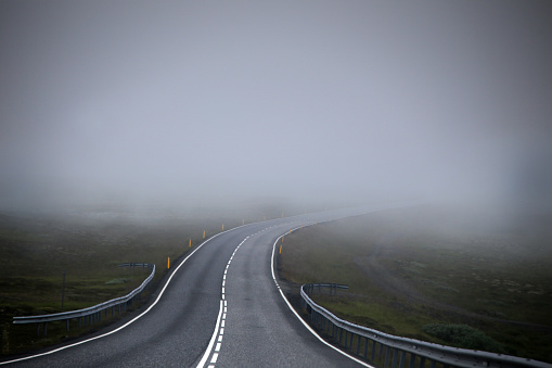 Road in fog (mist). The picture was taken in Iceland in July 2017
