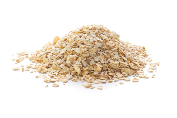 rolled oats on white - oatmeal rolled oats oat raw imagens e fotografias de stock