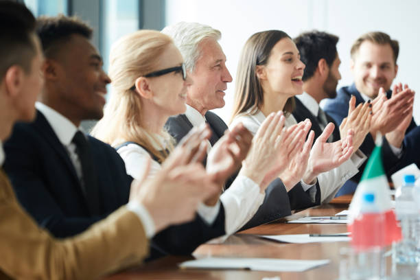 istock Excited government representatives applauding after meeting 1015264446