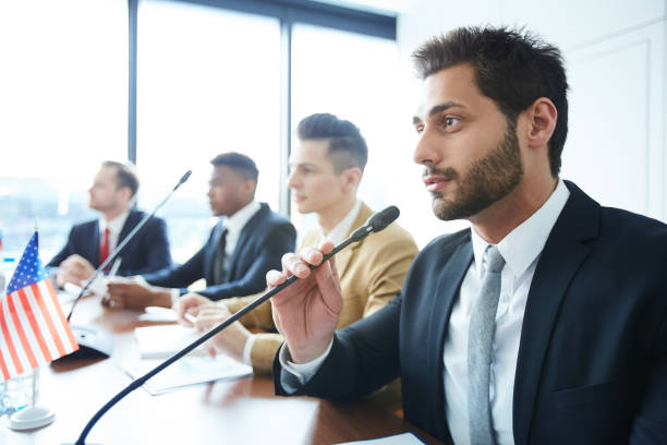 istock Handsome politician participating in debate 1015266542