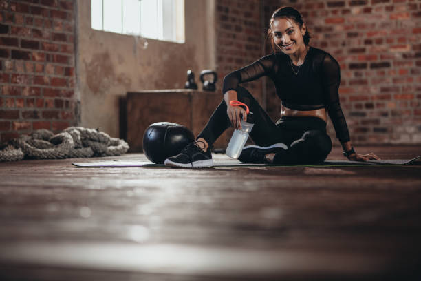 istock Female resting after exercise at fitness studio 1015267542