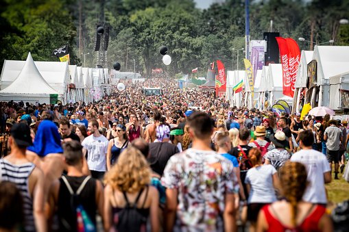 Kostrzyn Nad Odra, Poland - August 02, 2018:Hude crowd of young people walking through  the main street of the festival campground at 24th Pol'and'rock Festival - the biggest open air ticket free rock music festival in Europe