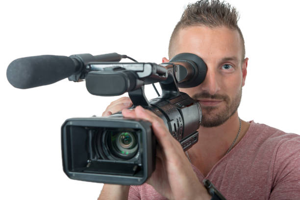 istock man with professional camcorder isolated on the white background 1015277176
