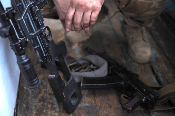 istock soldier hands and Sniper rifle close up. war 1015280650