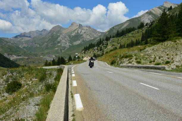 istock road in the mountains with clouds 1015280854
