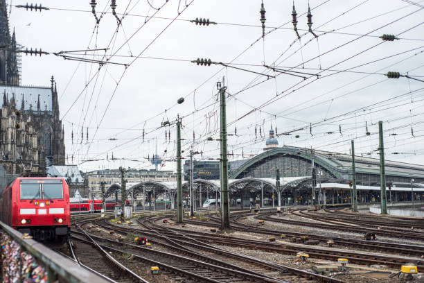 istock red train depart from the station Cologne Germany. 1015288124